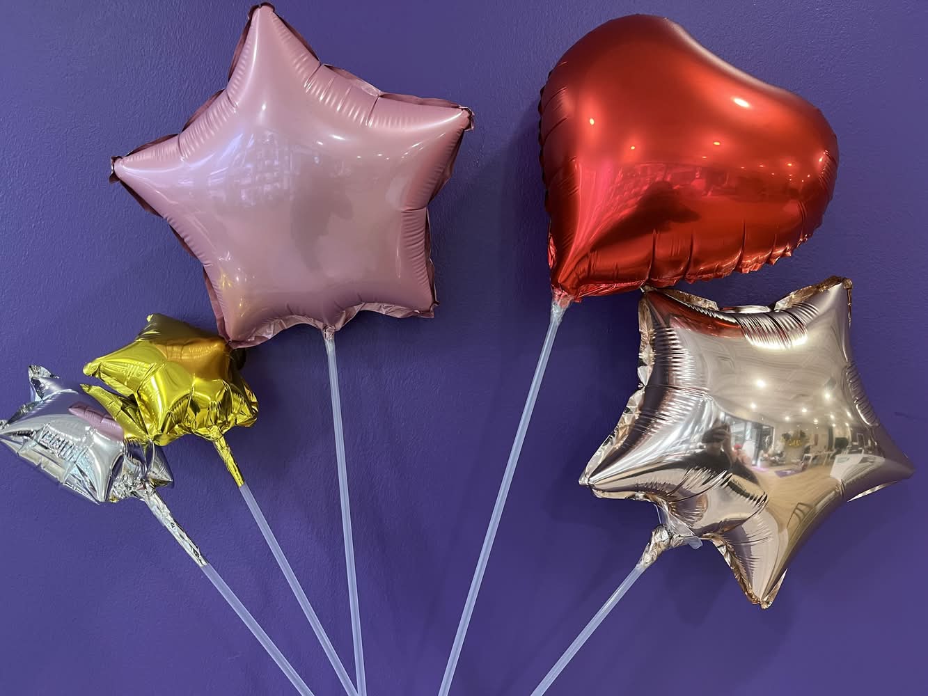 Simple metallic balloons (best suited to your flowers)