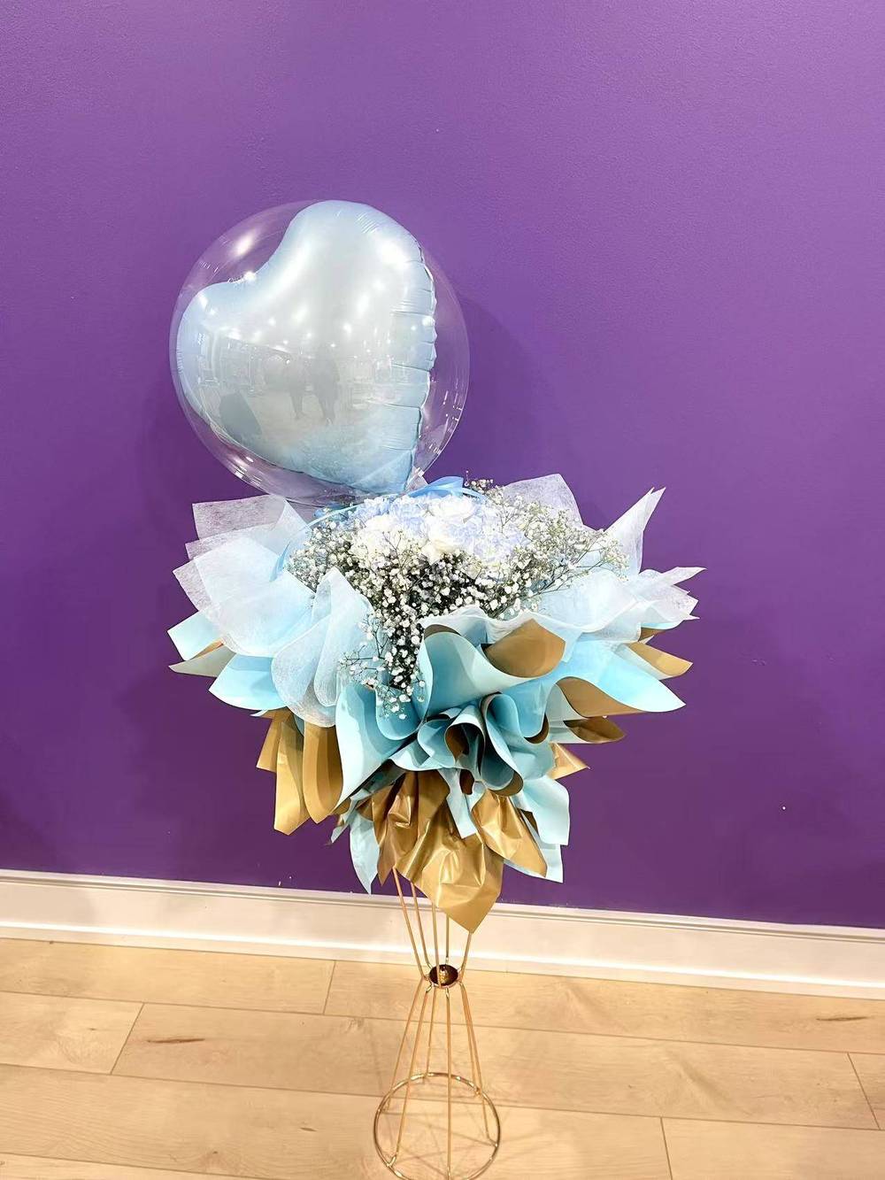 Blue carnations and baby's breath bouquet with love heart balloons